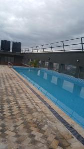 a large swimming pool on top of a building at Naivasha road Studio Opposite ILRI in Nairobi