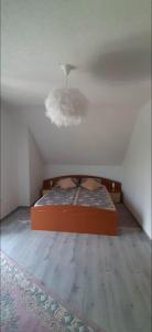 a bedroom with a bed and a ceiling at Vikendica Sana in Sanski most