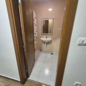 a small bathroom with a sink and a toilet at Apartmani Han in Bijelo Polje