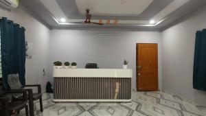 an office with a reception desk in a room at Sai krishna residency in Pithāpuram