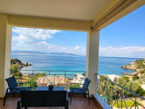 a balcony with a view of the ocean at The View in Souvala