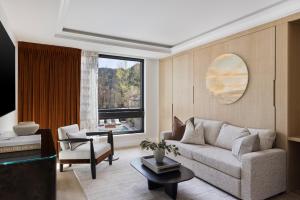 a living room with a couch and a table at White Elephant Aspen in Aspen