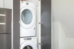 a white washer and dryer in a bathroom at Downtown Luxury 1BR Loft · Walkable · Sleeps 4 in Milwaukee