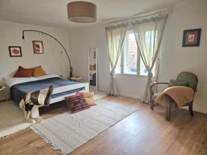 a bedroom with a bed and a window at Porta in Bálványos +37 photos