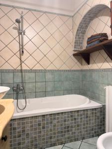 a bathroom with a bath tub and a sink at villa Cycas in Maratea +16 photos