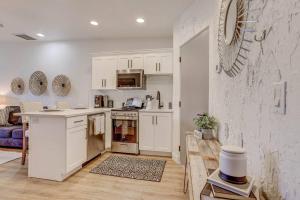 a kitchen with white cabinets and a counter top at Relaxing Quiet Resort - Dog Friendly in St. George