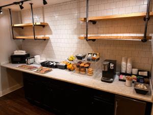 a kitchen with a counter with food on it at Hotel Hi-Ho - Contactless Check-In in Fairfield