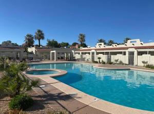 a large swimming pool in front of a house at Relaxing Quiet Resort - Dog Friendly in St. George