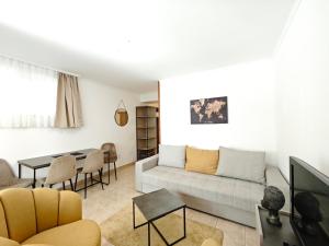 a living room with a couch and a table at Apartments Irena in Bečići