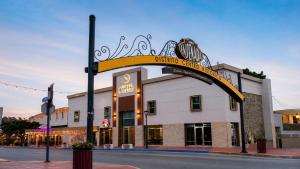 a building with a sign in front of it at Hotel Cortez Baja Inn, Ensenada in Ensenada