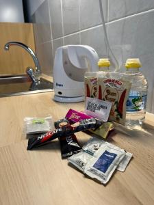 a pile of hygiene items on a counter next to a sink at Casa Vega-Marrero in Arucas