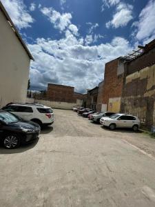 a group of cars parked in a parking lot at Riberas del Valle in Cuenca