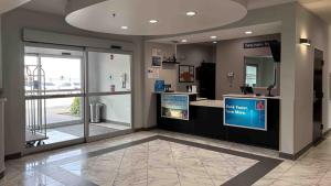 a lobby with a store with a large window at Motel 6-Weslaco, TX in Weslaco