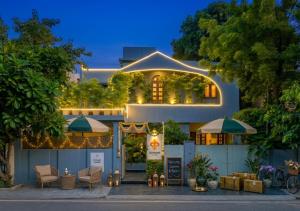 a house with lights in front of it at Giovanni House in Bhopal