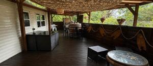 a screened in porch with a bar on a house at Parc Montana - Mobile home in Gassin