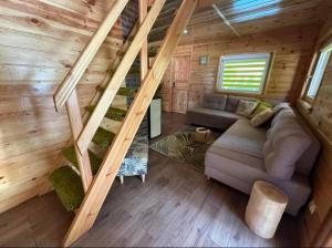 an overhead view of a living room in a tiny house at Hygge in Brenno