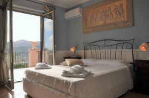 Postel nebo postele na pokoji v ubytování Villa Gramati
