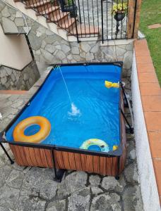 a large swimming pool with an inflatable at Evergreen House - Japartments in Genoa