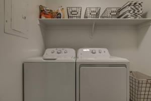 a kitchen with two white appliances and a shelf at Long Stays Welcome! Pet Friendly & Heated Pool in Washington