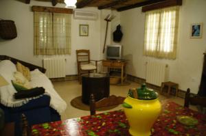 a living room with a couch and a table at El Garrotal in El Bosque