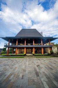 a large building with a black roof at Ndalem Prabu in Sarangan