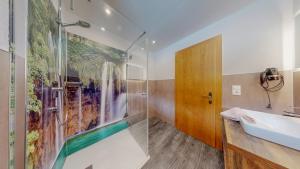 a bathroom with a shower and a sink at Appartement Belmonte in Sölden +50 photos