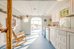 a kitchen with white cabinets and a blue floor at 4 Bed in Tintagel oc-trev in Treknow