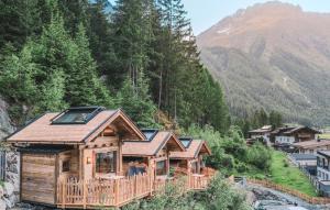a log cabin in the mountains with a mountain at BergNest in Huben