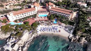 an aerial view of a resort and the ocean at Grand Hotel Smeraldo Beach in Baja Sardinia