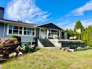 a house with sheep in the yard at Ivy s House in West Vancouver
