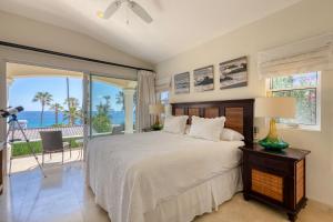a bedroom with a bed and a view of the ocean at Casa 4 C's in Cabo San Lucas +34 photos