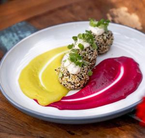 a white plate with some food on a table at Spa Tour Life in Montenegro