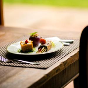 a plate with a piece of food on a table at Spa Tour Life in Montenegro