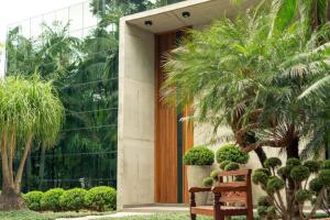 a wooden door with a bench in front of a building at Spa Tour Life in Montenegro