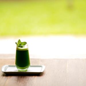 a green drink on a plate on a table at Spa Tour Life in Montenegro +3 photos