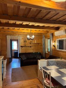 a living room with a couch and a table at Kinga House in Keszthely