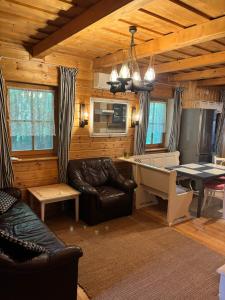 a living room with a couch and a table at Kinga House in Keszthely