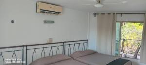 a couch in a room with a window at Hotel San Carlos in Tizimín +33 photos