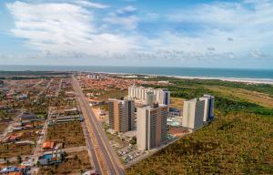 an aerial view of a city with the ocean at BEACH GAV Resorts in Salinópolis
