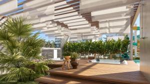 a balcony with palm trees and a wooden deck at BEACH GAV Resorts in Salinópolis