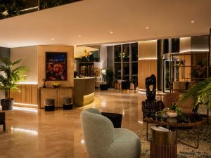 a lobby with a chair and a table at Handwritten Collection-Bucharest Unirii Square in Bucharest +51 photos