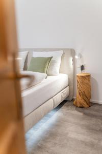 a white couch sitting in a room with a table at Moar Apartments in Silandro