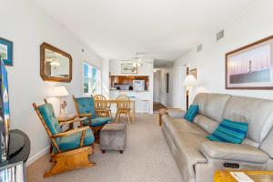a living room with a couch and chairs at AV2D - By The Sea in Nags Head