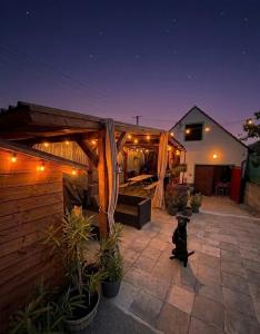 a dog sitting on a patio at night at ZAPOMENUTÝ SKLÍPEK in Olbramovice