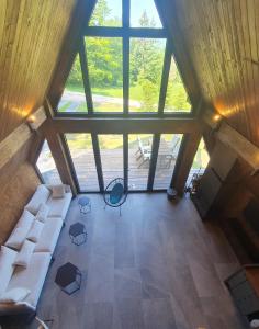 an overhead view of a living room with a large window at Vrleti Tare in Bajina Bašta