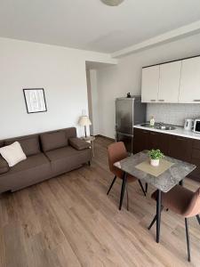 a living room with a couch and a table at Apartments & Rooms Alagić in Makarska