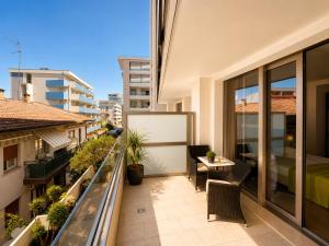 an apartment balcony with a view of a bedroom at HOTEL VENICE BEACH HVB 34 Lifestyle 4 Superior in Bibione