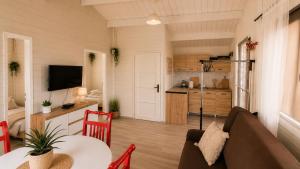 a living room with a couch and a table at Domek ASIA in Wronka