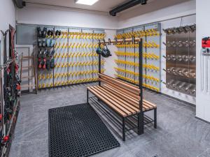 a bench in a dressing room with shoes at BergNest in Huben