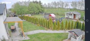an aerial view of a garden with a playground at Domek ASIA in Wronka